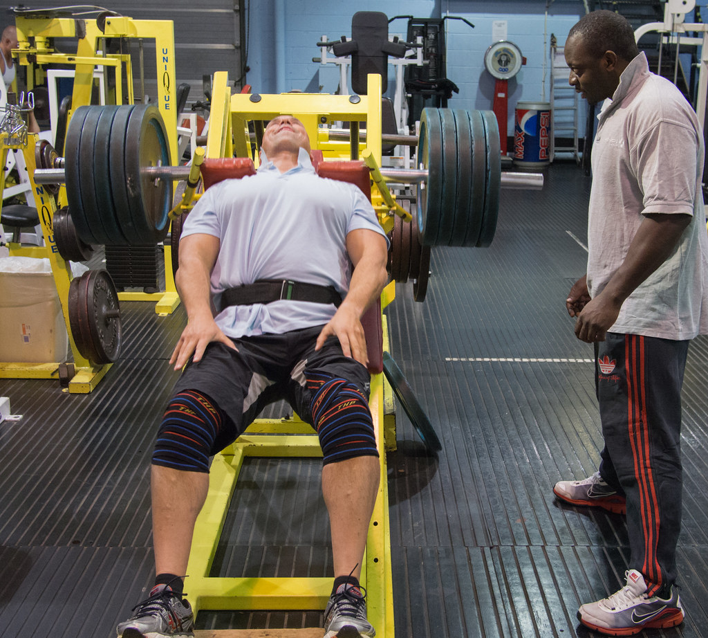 Placeholder image — lifter under a loaded barbell